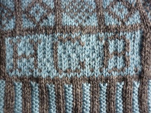 The initials showing the result of weaving in on the reverse